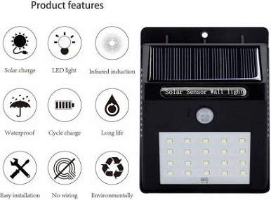 Waterproof solar wall light near garden path